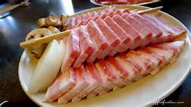 Sam Gyeop sal, a traditional Korean dish very similar to thick cut American bacon.